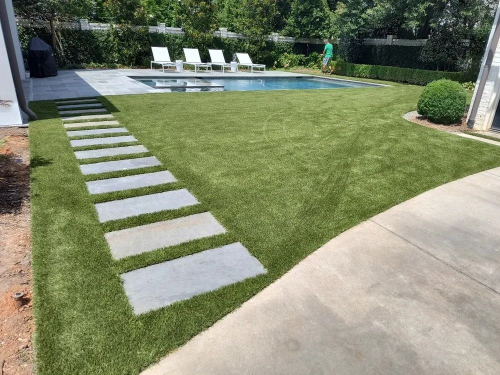 Turf and stepping stones around a pool